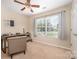 Comfortable bedroom features a ceiling fan, window, and neutral decor at 146 Pheasant Ridge Cir, York, SC 29745