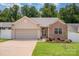 Charming single-Gathering home featuring a well-manicured lawn and a two-car garage in a desirable neighborhood at 146 Pheasant Ridge Cir, York, SC 29745