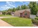Beautiful home with manicured lawn, showcasing the side of the property and the well-kept garden at 146 Pheasant Ridge Cir, York, SC 29745