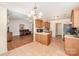 Open-concept kitchen with a breakfast bar, seamlessly flowing into the living area at 146 Pheasant Ridge Cir, York, SC 29745