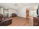 Bright and airy living room featuring hardwood floors and an open layout into the kitchen at 146 Pheasant Ridge Cir, York, SC 29745