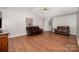 Spacious living room with hardwood floors, neutral walls and comfortable leather seating at 146 Pheasant Ridge Cir, York, SC 29745