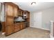 Basement bar boasts custom cabinetry, granite counters, and a wine fridge at 15024 Old Vermillion Dr, Huntersville, NC 28078