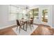 Cozy dining area with a large window and modern chandelier at 15024 Old Vermillion Dr, Huntersville, NC 28078