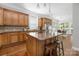 Open kitchen featuring a central island and wood cabinetry at 15024 Old Vermillion Dr, Huntersville, NC 28078
