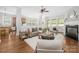 Spacious living room featuring hardwood floors, a fireplace, and an open floor plan at 15024 Old Vermillion Dr, Huntersville, NC 28078