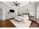 This bedroom features a decorative ceiling, ceiling fan, and a large window at 15024 Old Vermillion Dr, Huntersville, NC 28078