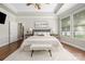 This bedroom features a decorative ceiling, ceiling fan, and a large window at 15024 Old Vermillion Dr, Huntersville, NC 28078