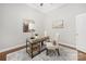 Bright office space with a neutral palette, decorative rug, modern desk, and comfortable chair at 15024 Old Vermillion Dr, Huntersville, NC 28078