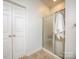 Simple bathroom featuring tile floors, a glass door shower, and a storage closet at 155 Culpeze Rd, Mooresville, NC 28117