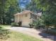 Exterior of the home featuring a driveway, two-car garage and a basketball hoop at 155 Culpeze Rd, Mooresville, NC 28117