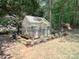 Backyard greenhouse with plants and a variety of potted flowers at 155 Culpeze Rd, Mooresville, NC 28117