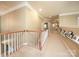 Upstairs hallway showcasing natural light and classic railings at 155 Culpeze Rd, Mooresville, NC 28117