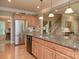 Kitchen with stainless steel refrigerator, granite countertops and adjacent breakfast area at 155 Culpeze Rd, Mooresville, NC 28117