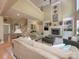 Spacious living room with a cozy fireplace, built-in shelves and soaring ceilings at 155 Culpeze Rd, Mooresville, NC 28117