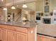 Open-concept living space with granite countertops, stainless appliances and a view to the Gathering room at 155 Culpeze Rd, Mooresville, NC 28117