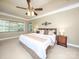 A spacious primary bedroom that offers a tray ceiling, fan and carpet at 155 Culpeze Rd, Mooresville, NC 28117