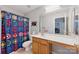 The bathroom includes a colorful shower curtain, vanity, and mirror at 158 Snead Rd, Fort Mill, SC 29715