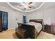 This cozy bedroom features a tray ceiling with fan and a warm, inviting atmosphere at 158 Snead Rd, Fort Mill, SC 29715