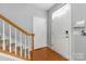 Inviting entryway features hardwood floors, stairs, and a storm door allowing natural light to flood the space at 158 Snead Rd, Fort Mill, SC 29715