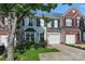 Inviting townhome featuring neat landscaping, an attached garage, and an attractive front door with wreath at 158 Snead Rd, Fort Mill, SC 29715