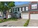 Well-maintained townhome showcasing a tidy lawn, attached garage, and welcoming front entrance at 158 Snead Rd, Fort Mill, SC 29715