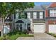 Charming townhome with neutral siding, black shutters, an attached garage, and manicured landscaping at 158 Snead Rd, Fort Mill, SC 29715