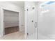 Bathroom with walk-in shower with glass door and a view into walk-in closet at 1651 Carolina Cir, Gastonia, NC 28054