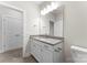 Bathroom with granite countertop vanity, large mirror, and modern fixtures at 1651 Carolina Cir, Gastonia, NC 28054