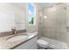 Bathroom featuring granite countertops, a glass-enclosed shower, and modern fixtures at 1651 Carolina Cir, Gastonia, NC 28054