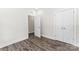 Neutral bedroom with wood-look floors, a double closet, and a view into the hallway at 1651 Carolina Cir, Gastonia, NC 28054