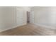 Bedroom featuring doorways and neutral carpeting throughout at 1651 Carolina Cir, Gastonia, NC 28054