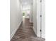 Hallway featuring wood-look flooring and light walls, providing a clean and inviting space at 1651 Carolina Cir, Gastonia, NC 28054