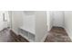 Entryway featuring a built-in mudroom bench and shelves, adjacent to a hallway at 1651 Carolina Cir, Gastonia, NC 28054
