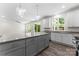 This kitchen features granite countertops, stainless steel appliances and light gray cabinetry at 1651 Carolina Cir, Gastonia, NC 28054