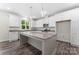 This spacious kitchen features granite countertops, stainless steel appliances and bright white cabinetry at 1651 Carolina Cir, Gastonia, NC 28054