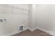 Laundry room with white walls, tile flooring and hookups for a washer and dryer at 1651 Carolina Cir, Gastonia, NC 28054
