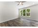 The sunlit living room has contemporary floors, and a ceiling fan at 1651 Carolina Cir, Gastonia, NC 28054
