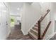 Staircase with carpeted steps and wood railing, leading to the upper level of the home at 1651 Carolina Cir, Gastonia, NC 28054