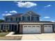 Charming two-story home featuring a stone veneer and a three-car garage at 166 Swann Rd # 5, Statesville, NC 28625