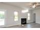 Bright and airy living room featuring a fireplace, ceiling fan and hardwood style flooring at 166 Swann Rd # 5, Statesville, NC 28625