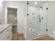 Beautiful bathroom features a glass shower with white subway tiles and gold fixtures at 1783 Radio Station Rd, Newton, NC 28658