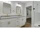 Elegant bathroom boasts dual sinks with granite countertops and gold fixtures at 1783 Radio Station Rd, Newton, NC 28658