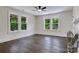 Bright bedroom with ceiling fan and large windows offering lots of natural light at 1783 Radio Station Rd, Newton, NC 28658