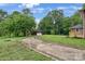 Long, winding driveway leads to a house and detached garage surrounded by lush trees offering privacy at 1783 Radio Station Rd, Newton, NC 28658