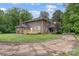 Spacious brick home featuring a back deck and mature trees, perfect for outdoor living and entertaining at 1783 Radio Station Rd, Newton, NC 28658