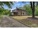 Traditional brick home with a well-maintained lawn and tree providing curb appeal and a welcoming ambiance at 1783 Radio Station Rd, Newton, NC 28658