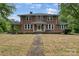 Charming brick home with a manicured lawn and symmetrical design exuding timeless elegance at 1783 Radio Station Rd, Newton, NC 28658