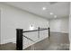 Upstairs hallway with hardwood floors and white railing at 1783 Radio Station Rd, Newton, NC 28658