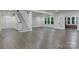 Open-concept living area with hardwood floors, staircase, and natural light at 1783 Radio Station Rd, Newton, NC 28658